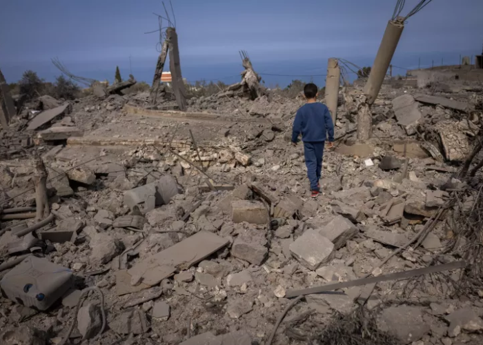 On February 22, 2024, friends of Hassan Al Durr, a 5-year-old girl killed in an airstrike, visit the aftermath of the deadly airstrike that claimed her life. Majdal Zoun, Southern Lebanon